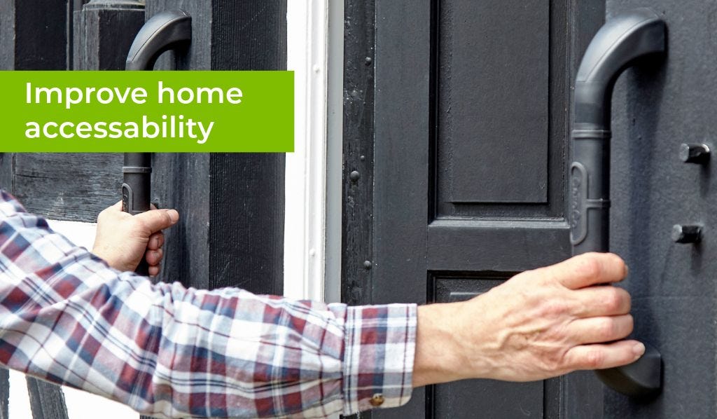 man using grab bars by front door of home