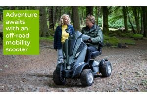 man riding an all-terrain mobility scooter in the woods