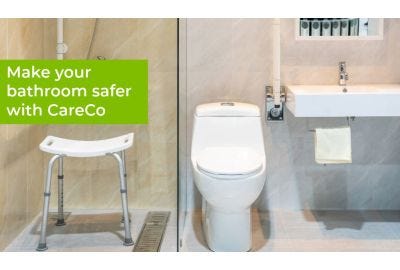 bathroom featuring some grab rails and shower stool
