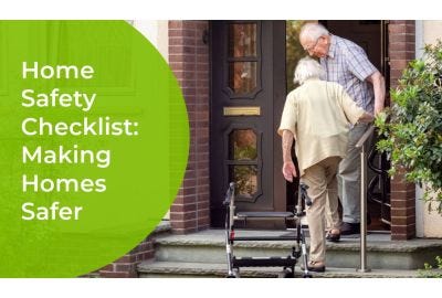 elderly couple climbing steps to their front door