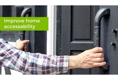 man using grab bars by front door of home