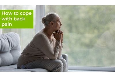 woman sitting with back pain