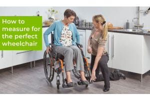 OT checking a wheelchair is a good fit