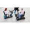 people on mobility scooters in a shopping centre
