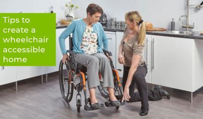 Woman in a wheelchair in her kitchen with an OT