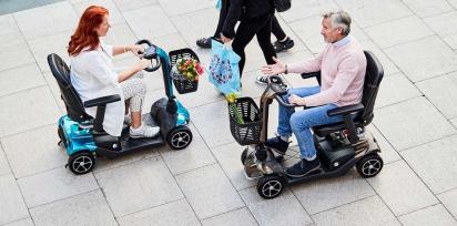 people on mobility scooters in a shopping centre