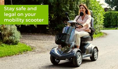 woman riding a mobility scooter along a road