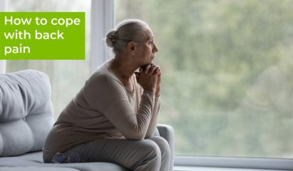woman sitting with back pain