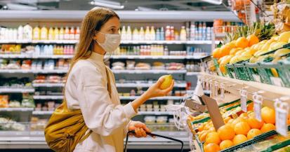 woman wearing a mask food shopping