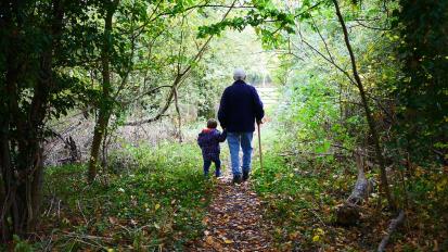 granddad walking with grandchild