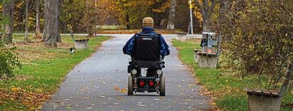 man on electric wheelchair in the park