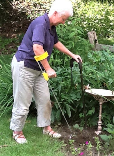 Lady with a long reach tool