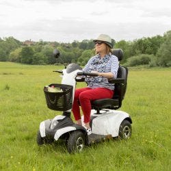 Vega RS8 mobility scooter in a park with long grass
