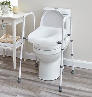 toilet frame and raised seat over a toilet