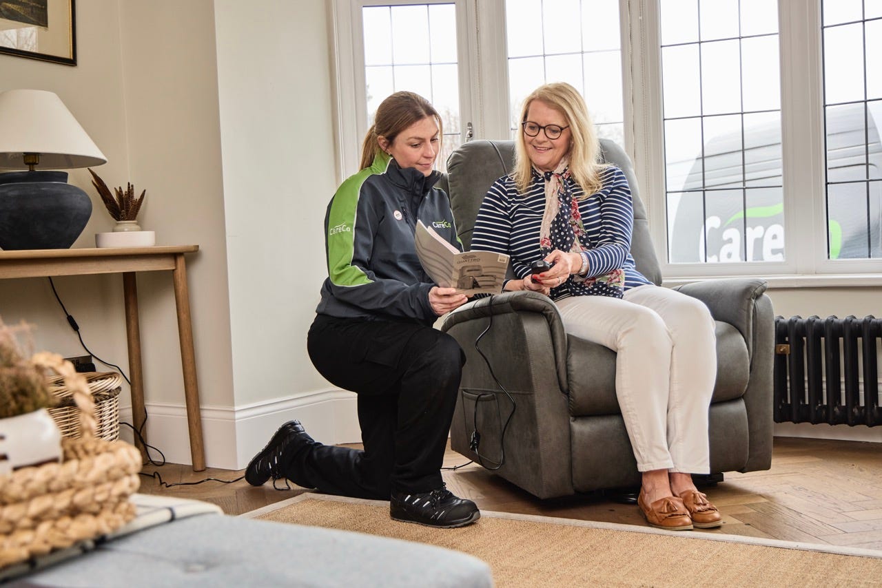 A customer getting a demonstration of her new chair during our Home Installation service