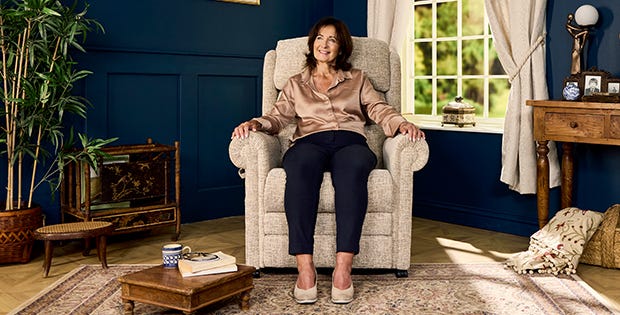 Woman sitting in Vitra Fireside Chair 