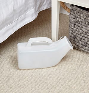 Urinal on a bedside cabinet