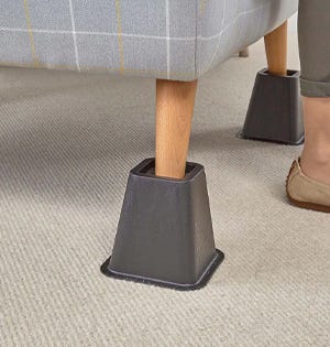 Furniture risers on fireside chair