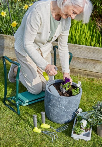 lady gardening with arthritic garden tools