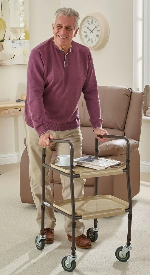 man using a home help troley