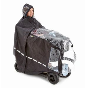 woman wearing a scooter cape on a mobility scooter