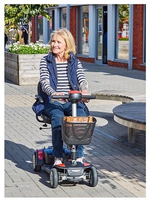 woman riding on a Spectrum mobility scooter