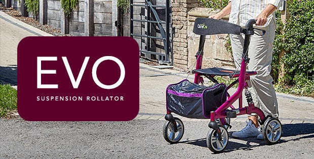 Woman pushing the Evo Suspension Rollator over pavement