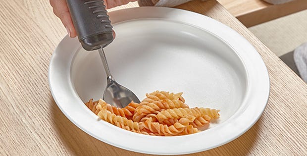 person each pasta with an arthritis friendly spoon