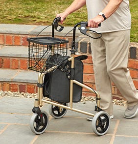 Person pushing the Kona Ultralight Tri-Walker on paved path