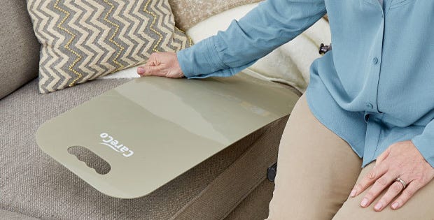 woman using a transfer board