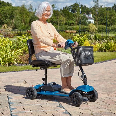 Woman driving mobility scooter